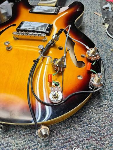 Why Semi-Hollow Guitars Hide Electronics Problems